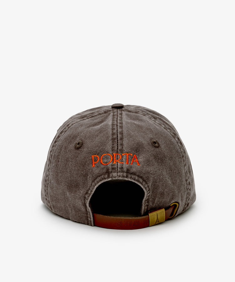 The Closed for August Cap, shown from the back in gray with PORTA embroidered in orange above an adjustable brown strap, blends style and sun protection—your essential accessory for any European out-of-office adventure.