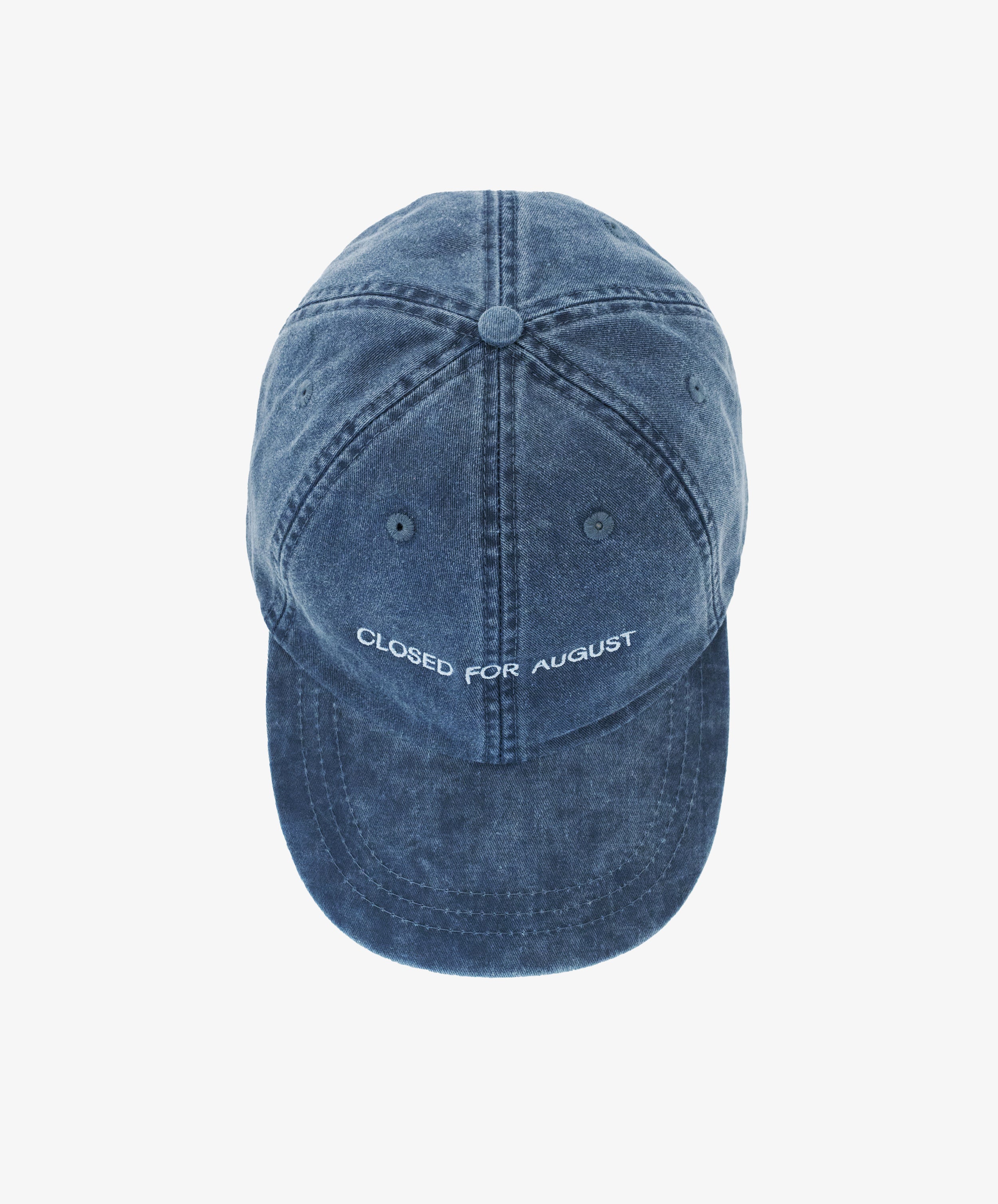 The Closed for August Cap is a blue denim hat with visible stitching and 
