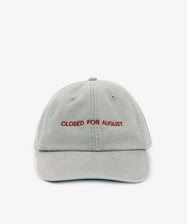The Closed for August Cap is a light gray sun protection cap featuring 