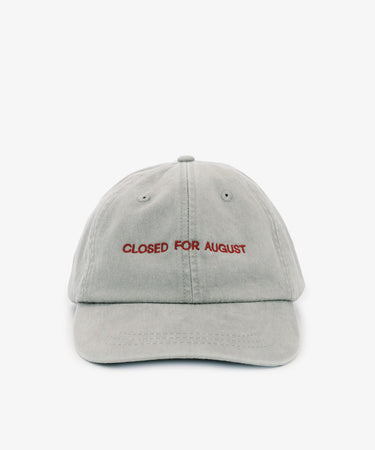 The Closed for August Cap is a light gray sun protection cap featuring 