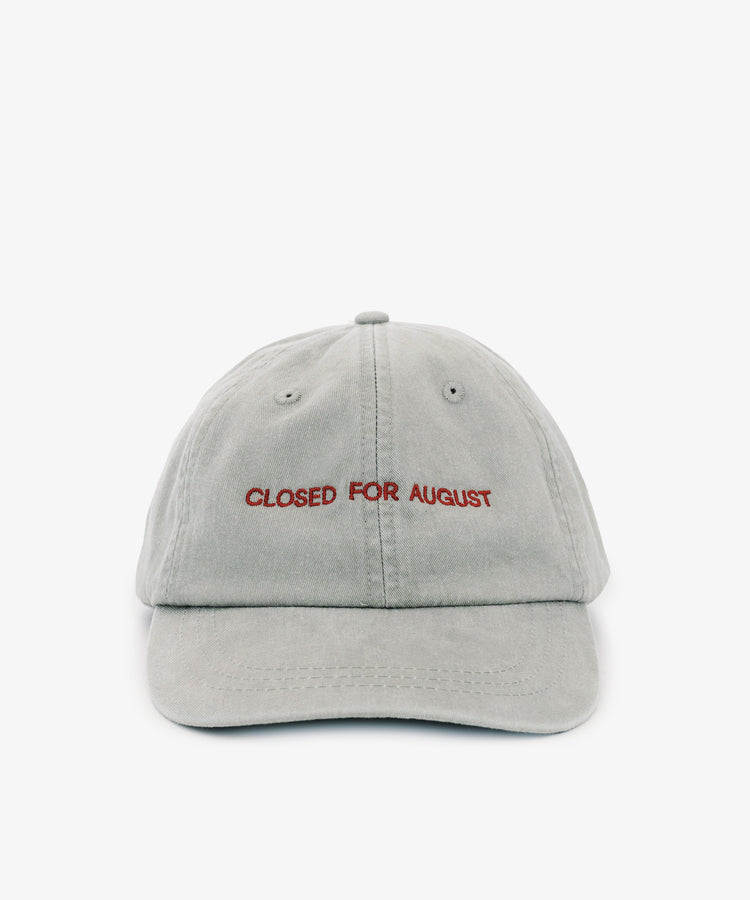 The Closed for August Cap is a light gray sun protection cap featuring 