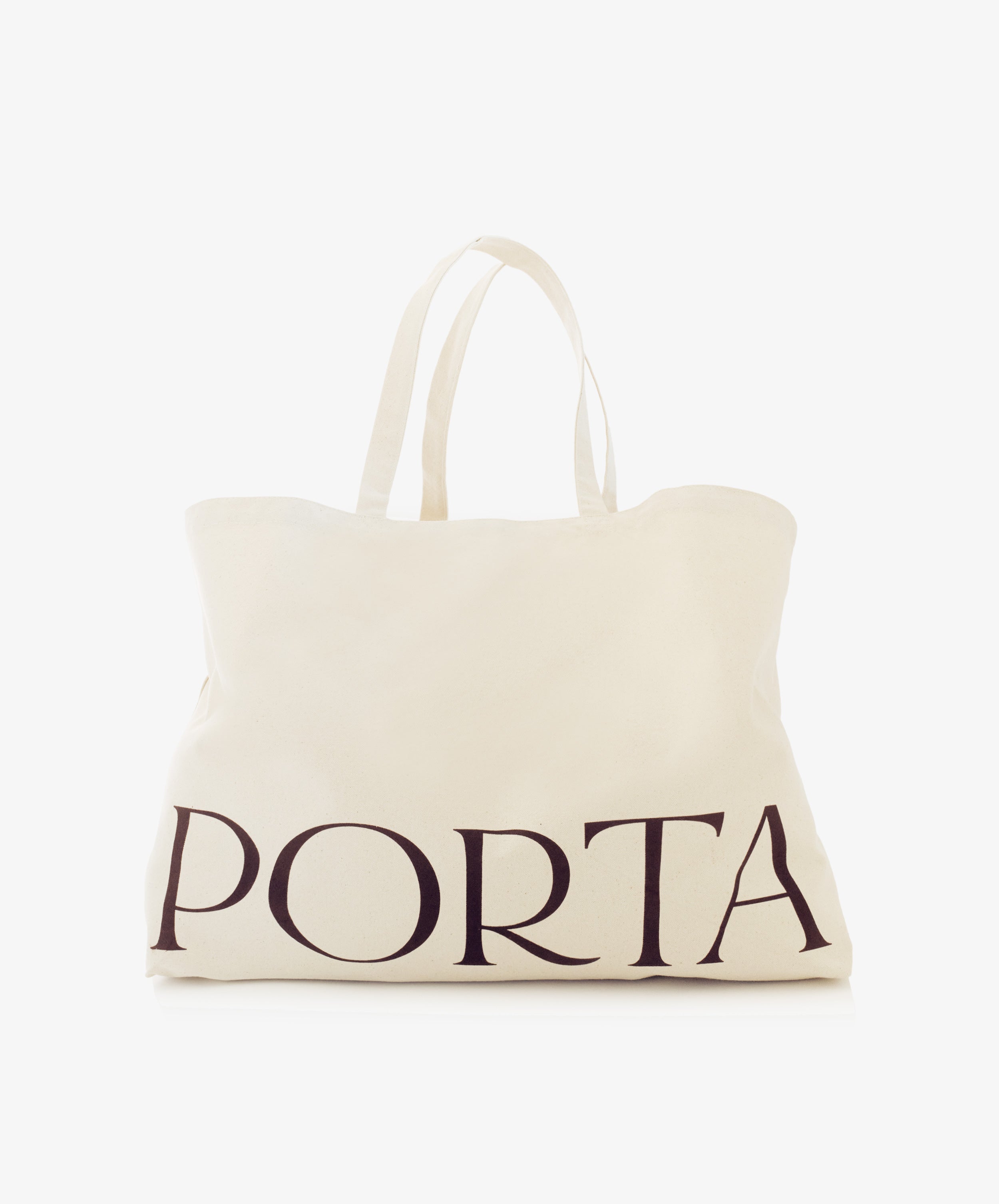 The PORTA Canvas Tote Bag is a plain off-white canvas tote with two handles and the word 