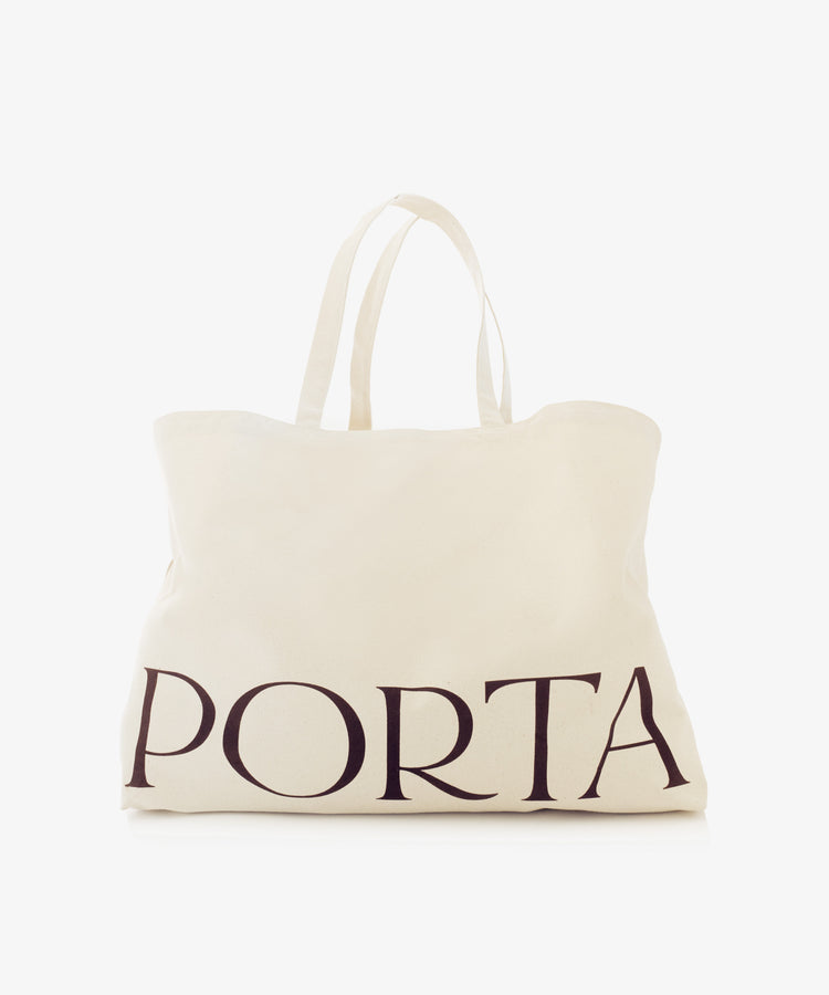 The PORTA Canvas Tote Bag is a plain off-white canvas tote with two handles and the word 