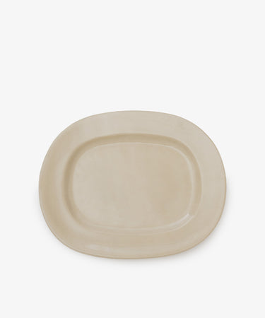 A large, rectangular off-white platter crafted from beige ceramic, set against a white background.