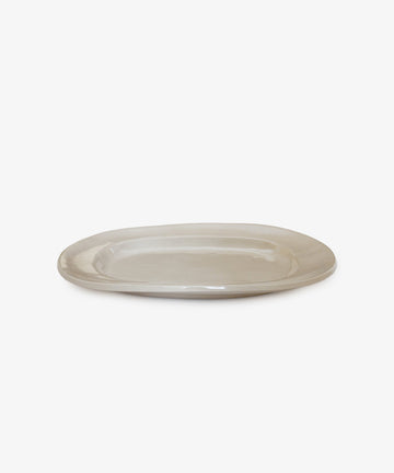 A large, rectangular off-white ceramic platter displayed against a white background.