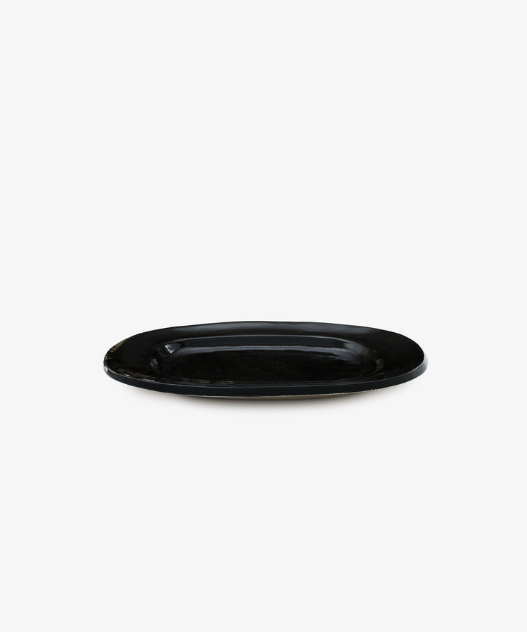 A Small Rectangular Platter in black ceramic is displayed against a plain white background, highlighting the modern elegance of contemporary tableware.