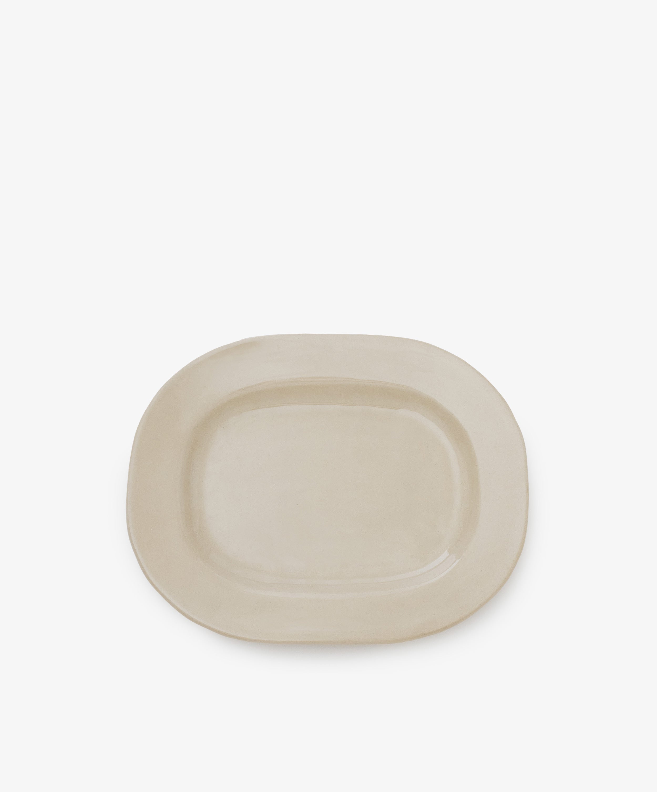 A simple off-white small rectangular ceramic platter with a matte finish is centered against a white background, making it ideal for everyday use.