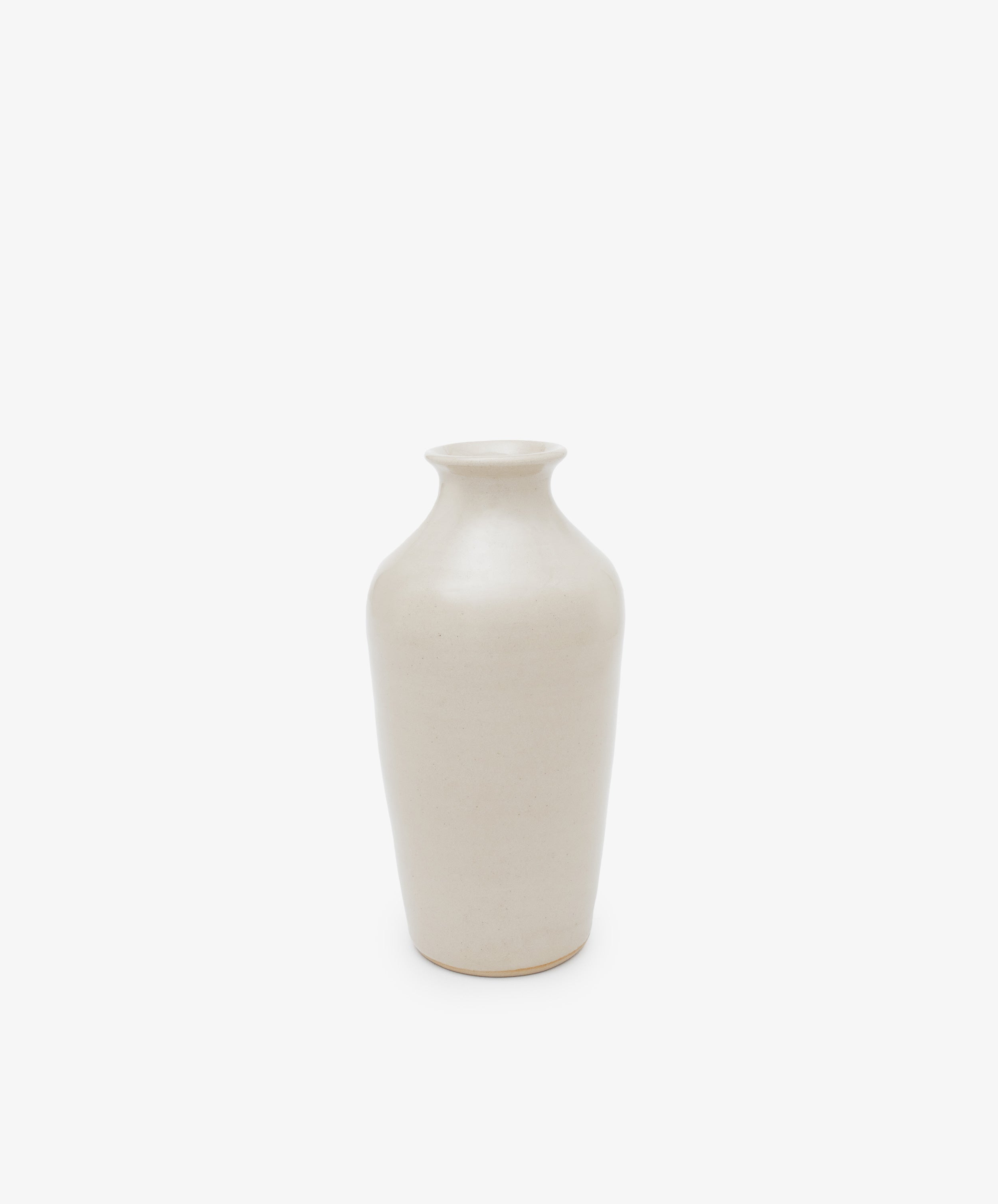 The Wheel Thrown Vase is a tall, off-white vase with a narrow neck and rounded shoulders, inspired by Delftware, shown on a white background.