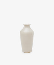 The Wheel Thrown Vase is a tall, off-white vase with a narrow neck and rounded shoulders, inspired by Delftware, shown on a white background.