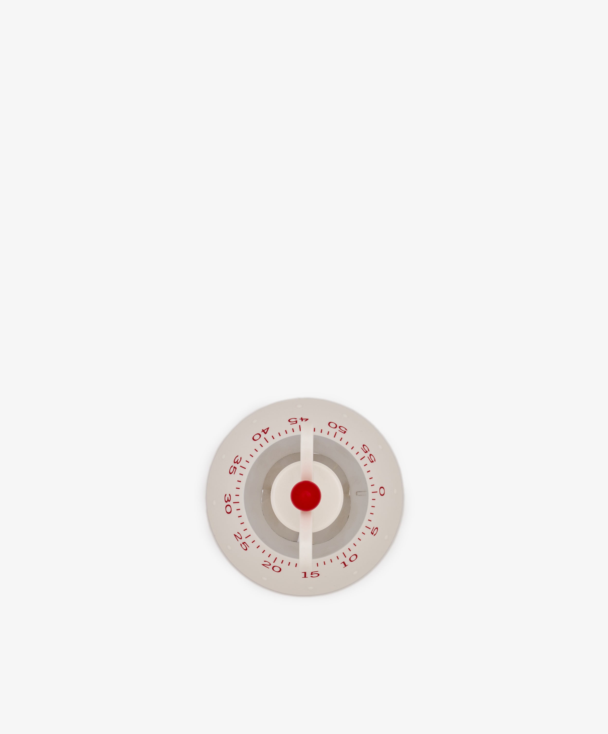 The Kitchen Timer, featuring a round white design with red numbers and a red center, is displayed against a plain white background.