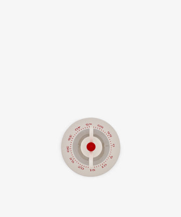 The Kitchen Timer, featuring a round white design with red numbers and a red center, is displayed against a plain white background.