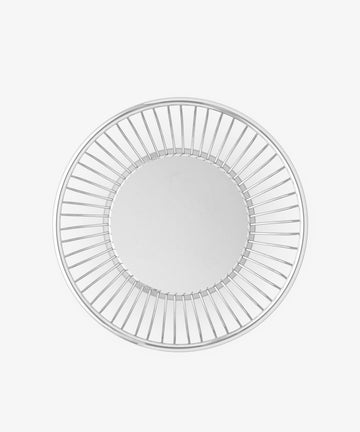 The Round Wire Basket features a solid flat base and evenly spaced vertical metal bars around the sides, forming a circular shape when viewed from above.