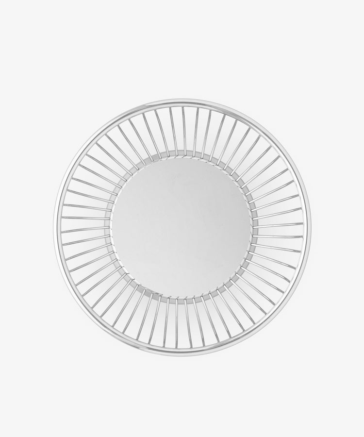 The Round Wire Basket features a solid flat base and evenly spaced vertical metal bars around the sides, forming a circular shape when viewed from above.