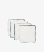 Four white Nico Cocktail Napkins with dark scalloped edges, arranged in a staggered stack against a plain white background.