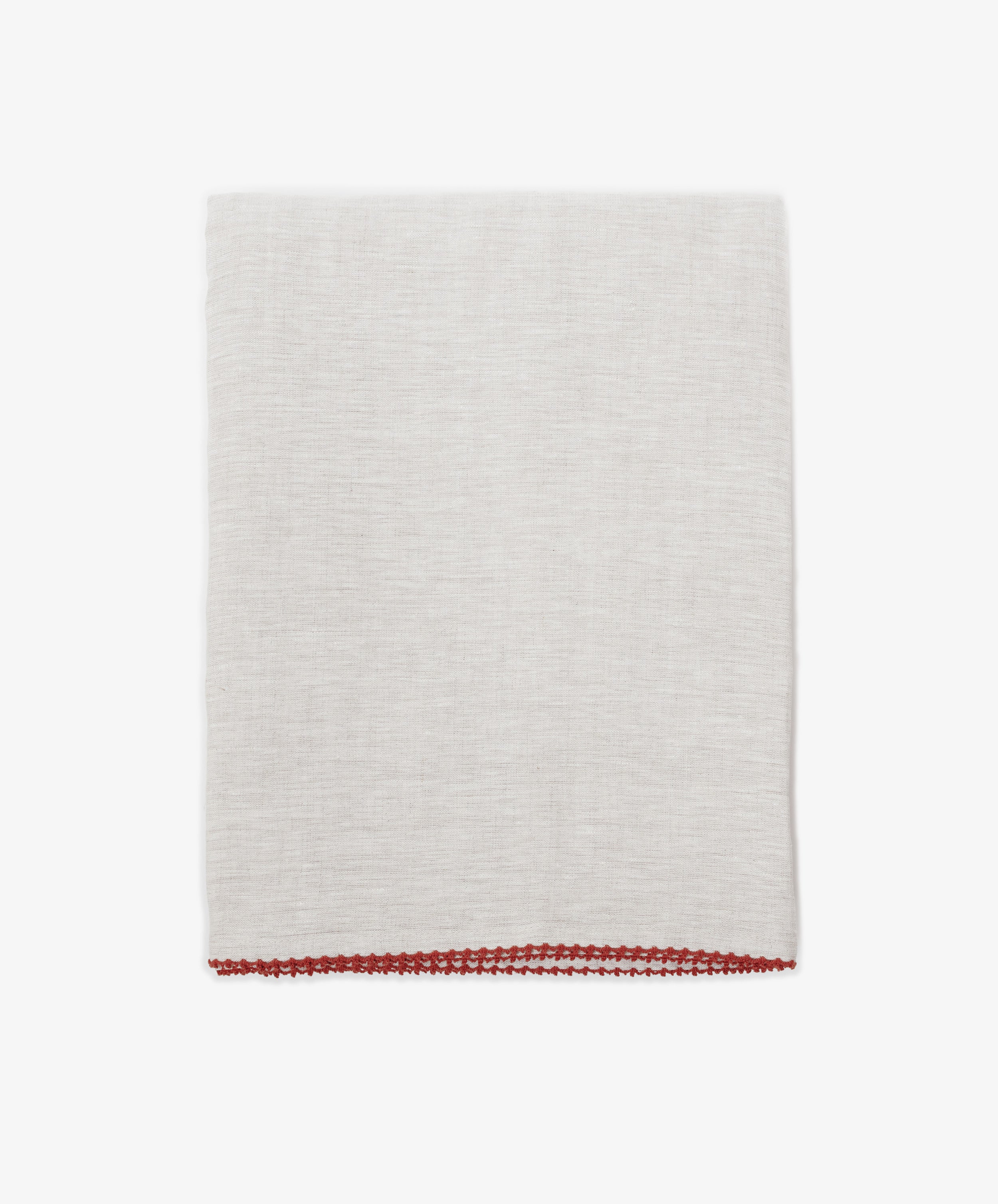 The Nico Tablecloth, in light gray linen with hand stitching and a red border along the bottom edge, is shown folded on a plain white background.