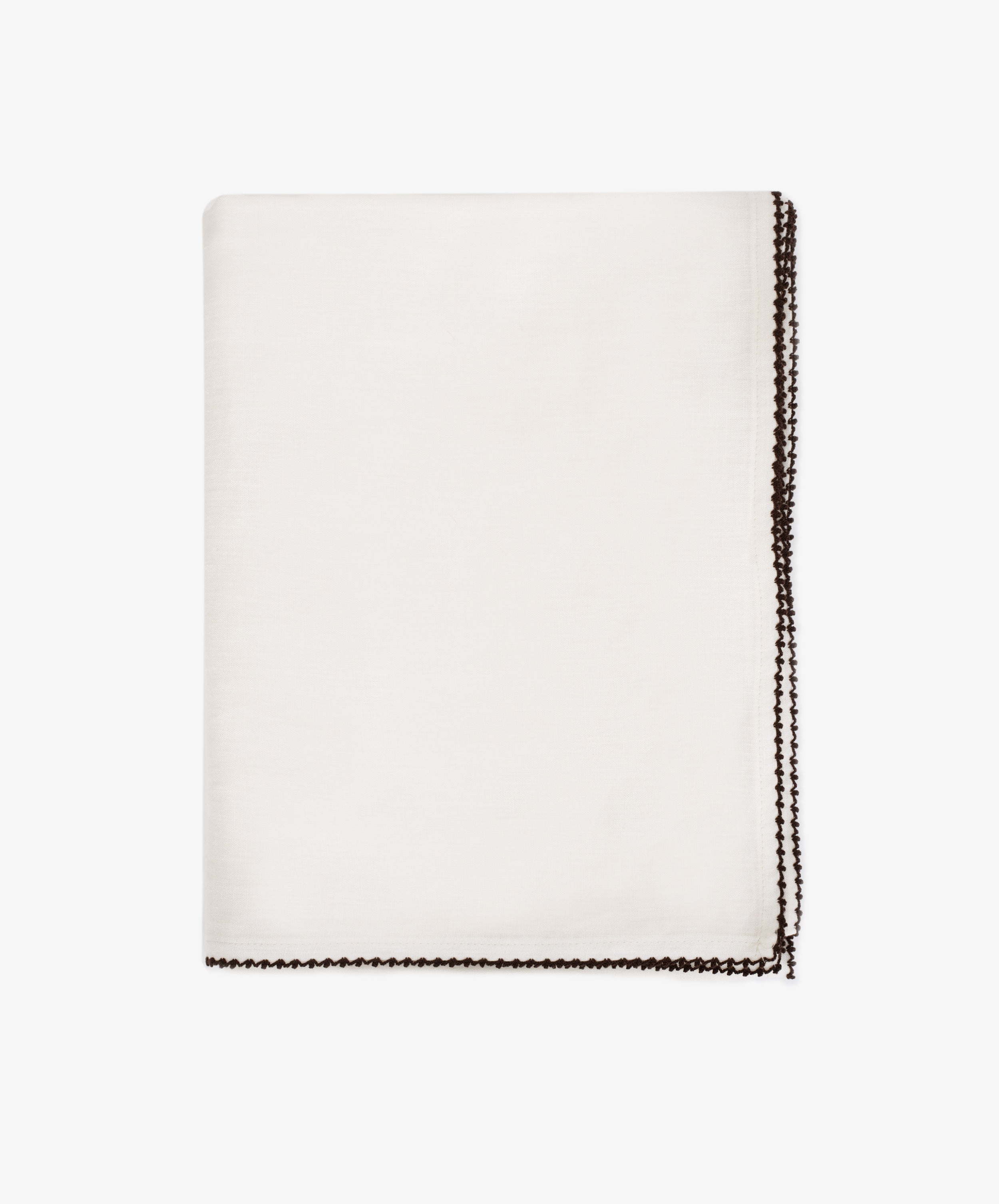The Nico Tablecloth, featuring contrast stitching along its dark decorative border, is neatly folded and displayed on a plain white background.