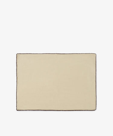 The Nico Placemat, Set of 6 features a rectangular design in beige linen with an espresso stitch border in a contrasting dark color, hand finished for a refined touch, and displayed on a plain white background.