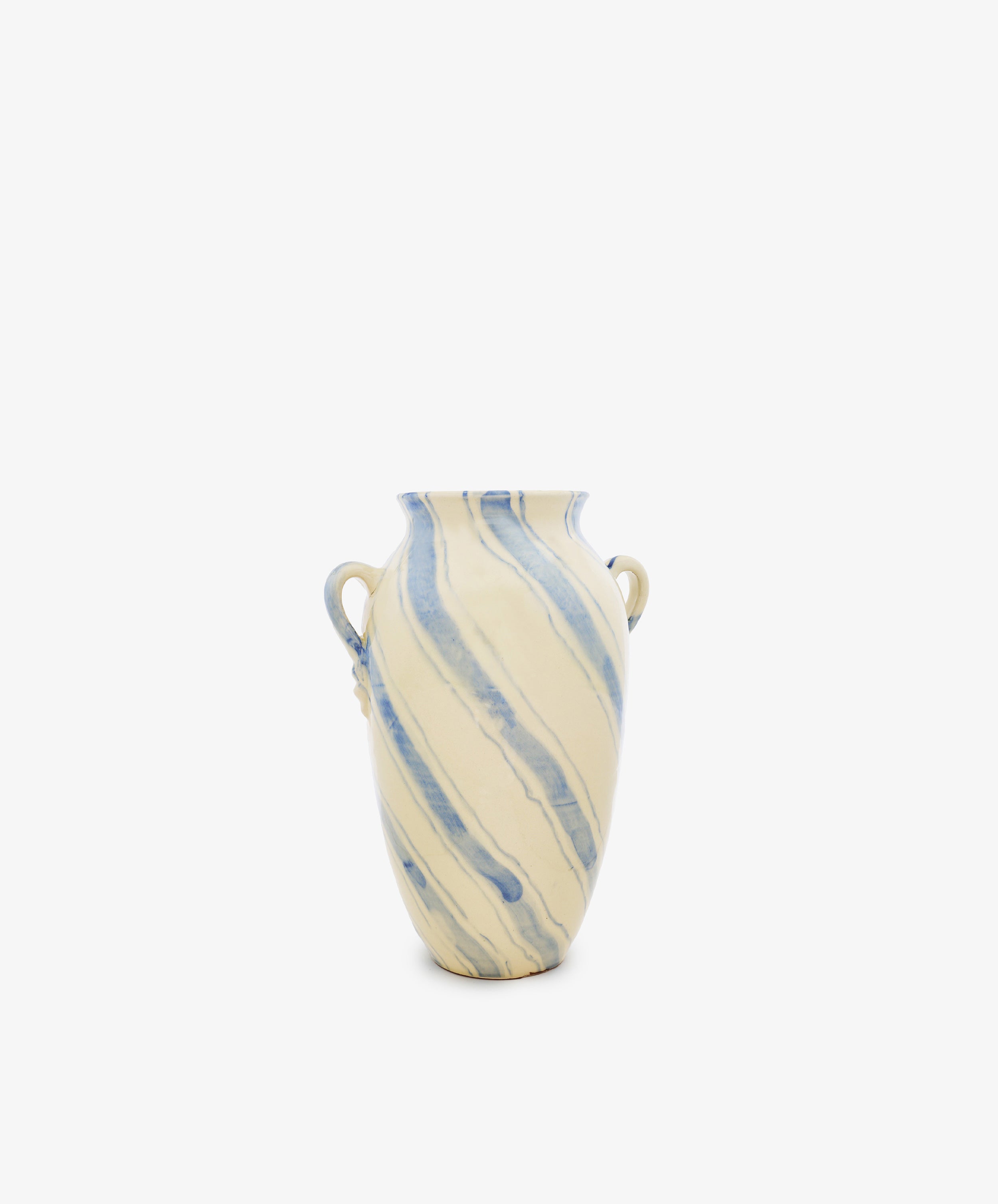 The Ida Vase features an amphora-shaped ceramic silhouette with two small side handles, showcasing a cream base color embellished with hand-painted blue diagonal marbled stripes, all set against a plain white background.