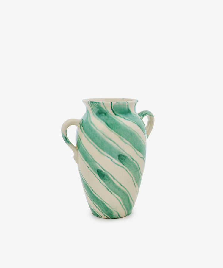 The Ida Vase is an amphora-shaped ceramic piece with two handles, showcasing a cream base highlighted by diagonal green stripes and abstract blue lines, set against a plain white background.