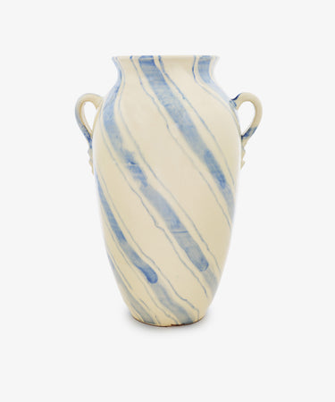 The Ida Vase is an amphora-shaped, cream-colored vase with two handles and diagonal blue streaks, ideal as a modern decorative accent for any space.