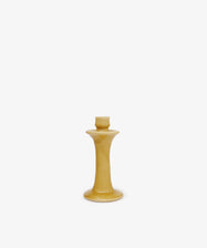 The Angelita Candleholder, a handcrafted yellow ceramic piece with a wide base and narrow neck, is displayed on a plain white background—ideal for adding Spanish charm to any space.