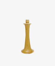 The Maria Candleholder is a yellow ceramic piece with a wide base and narrow top, handcrafted in Spain and shown against a plain white background.