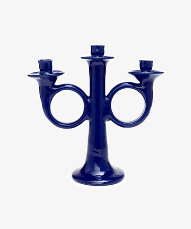Loretta Candelabra. Dark blue glazed ceramic candle holder with sculptural shape and space for three candles.