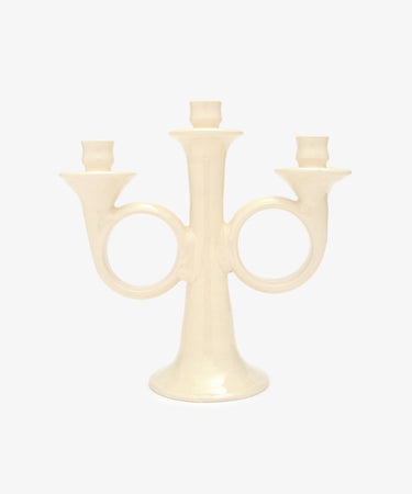 Loretta Candelabra. Ivory white glazed ceramic candle holder with sculptural shape and space for three candles.