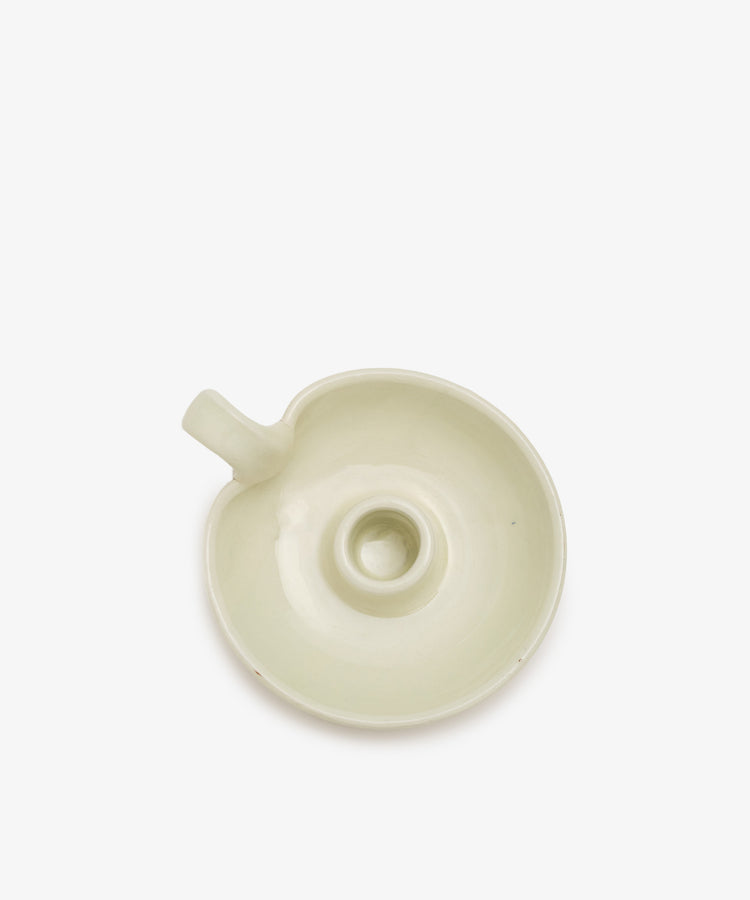 Overhead view of white glazed ceramic Balea Candle Holder. 