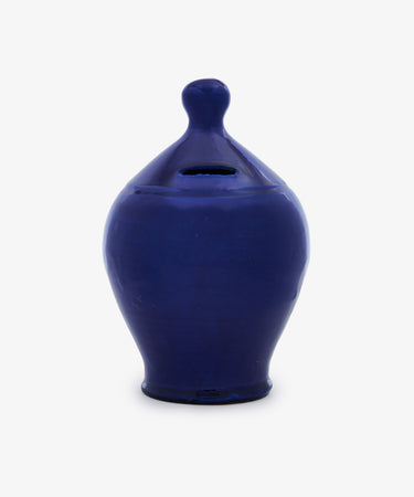 The Hugo Money Pot is a blue ceramic bank featuring a rounded body, narrow neck, and a coin slot near the top.