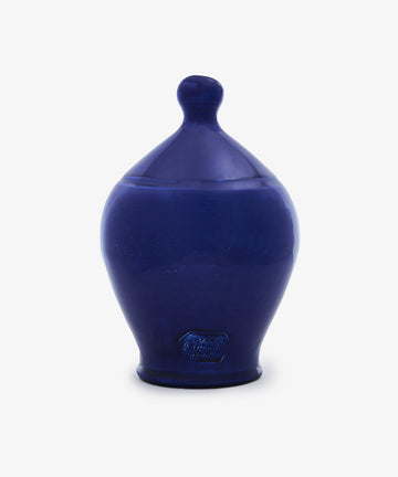 The Hugo Money Pot is a blue ceramic savings jar featuring a rounded body, narrow base, and a fitted lid with a knob, shown on a plain white background.