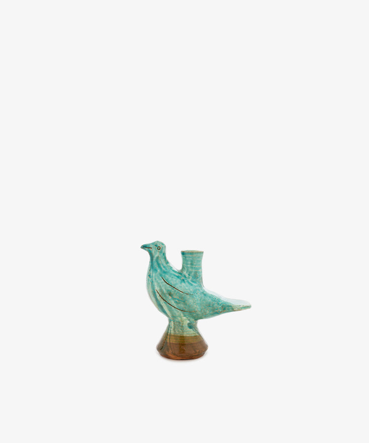 Peace Dove Candle Holder—this green and brown ceramic vessel, shaped like a bird and finished with a sage green glaze, features a small cylindrical opening on its back. Perfect as a unique bird candle holder, it is displayed centered on a plain white background.