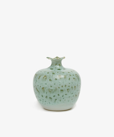Pom Bud Vase. Mottled light green glazed ceramic vase resembling a pomegranate.