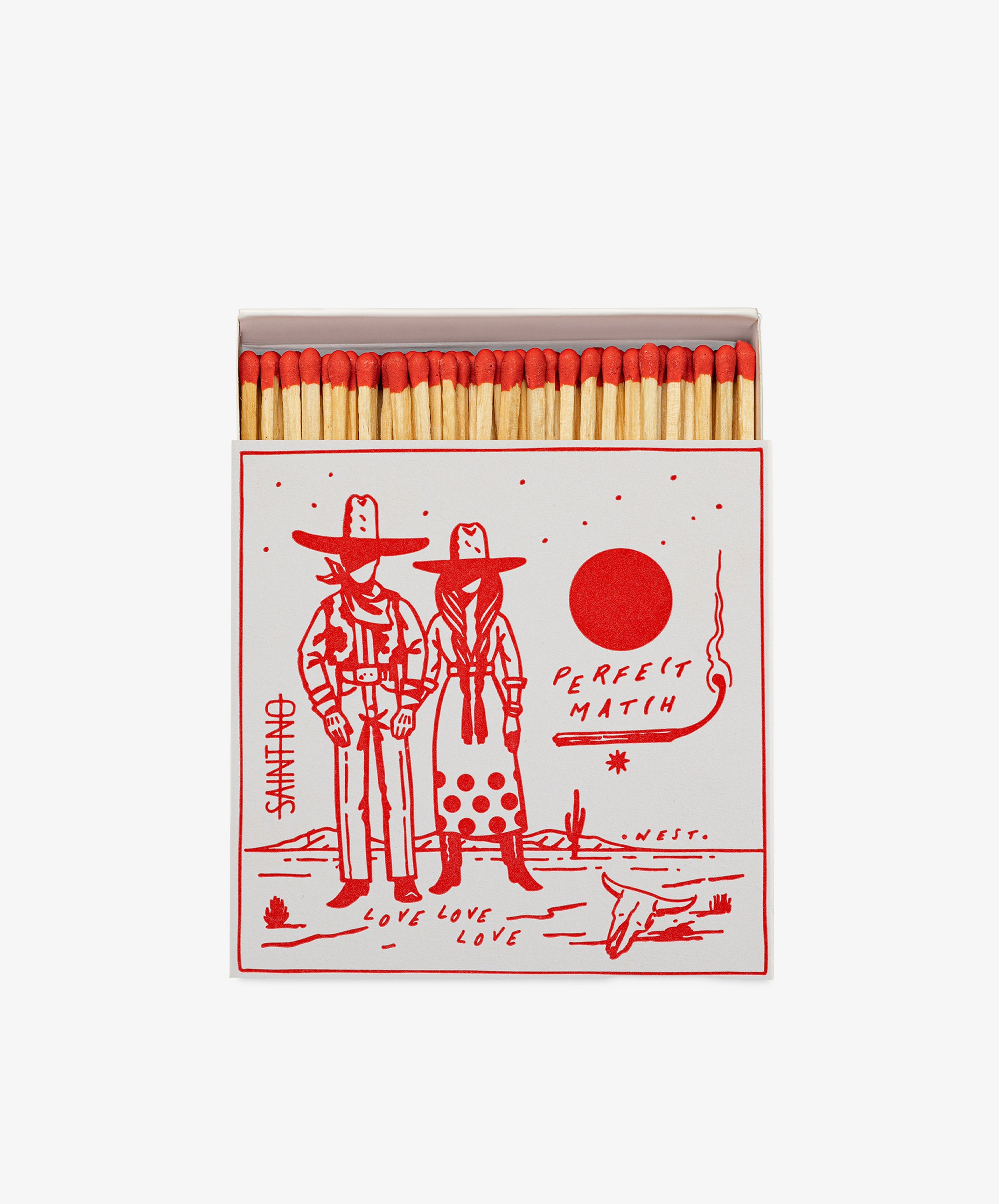 Luxury Matches come in a matchbox with red-tipped matches and an illustration of two cowboys under a red sun. The box reads PERFECT MATCH and LOVE LOVE LOVE, making it a perfect gift for any home.