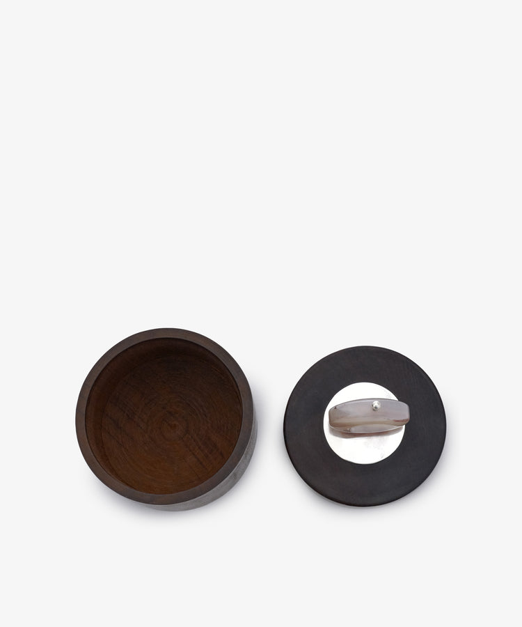 Curiosity Box 3—a round African wood box with its matching lid (featuring a metal handle) placed beside it to show the interior—set against a plain white background.