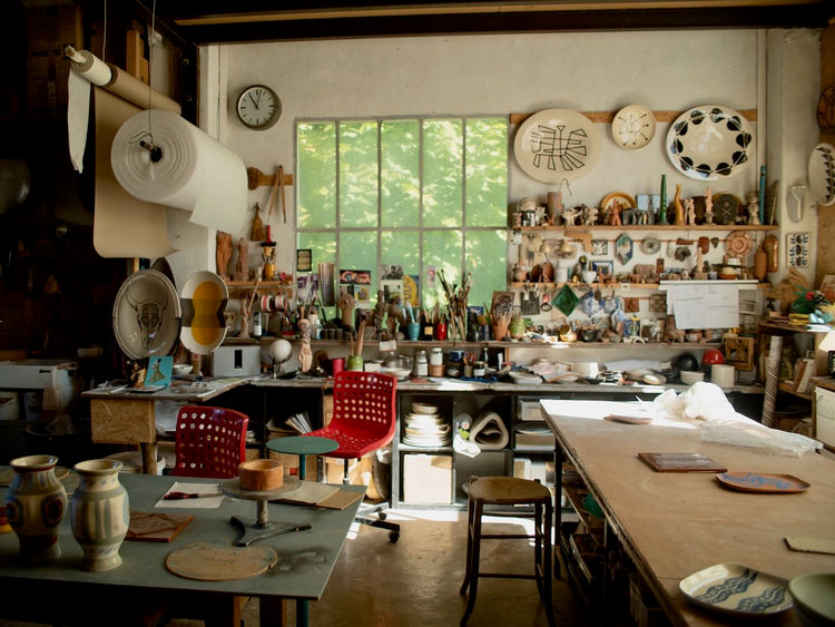 studio space with paint supplies and art and ceramics