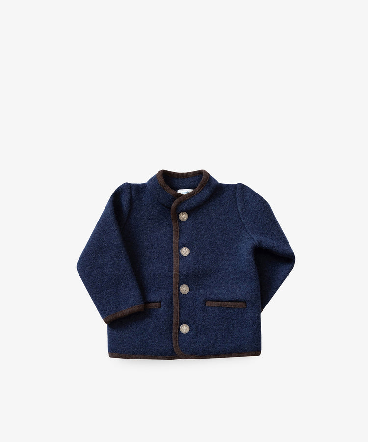 The Austrian Wool Jacket is a navy blue children’s merino wool jacket with a Nehru collar, brown trim, silver buttons, and two front pockets, shown on a white background.