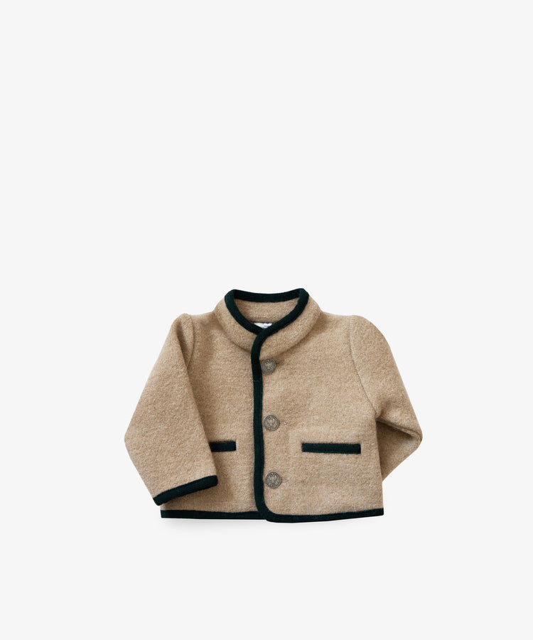 The Austrian Wool Jacket is a beige merino wool baby jacket featuring a Nehru collar, black trim, button front, and two black-trimmed pockets, shown on a plain white background.