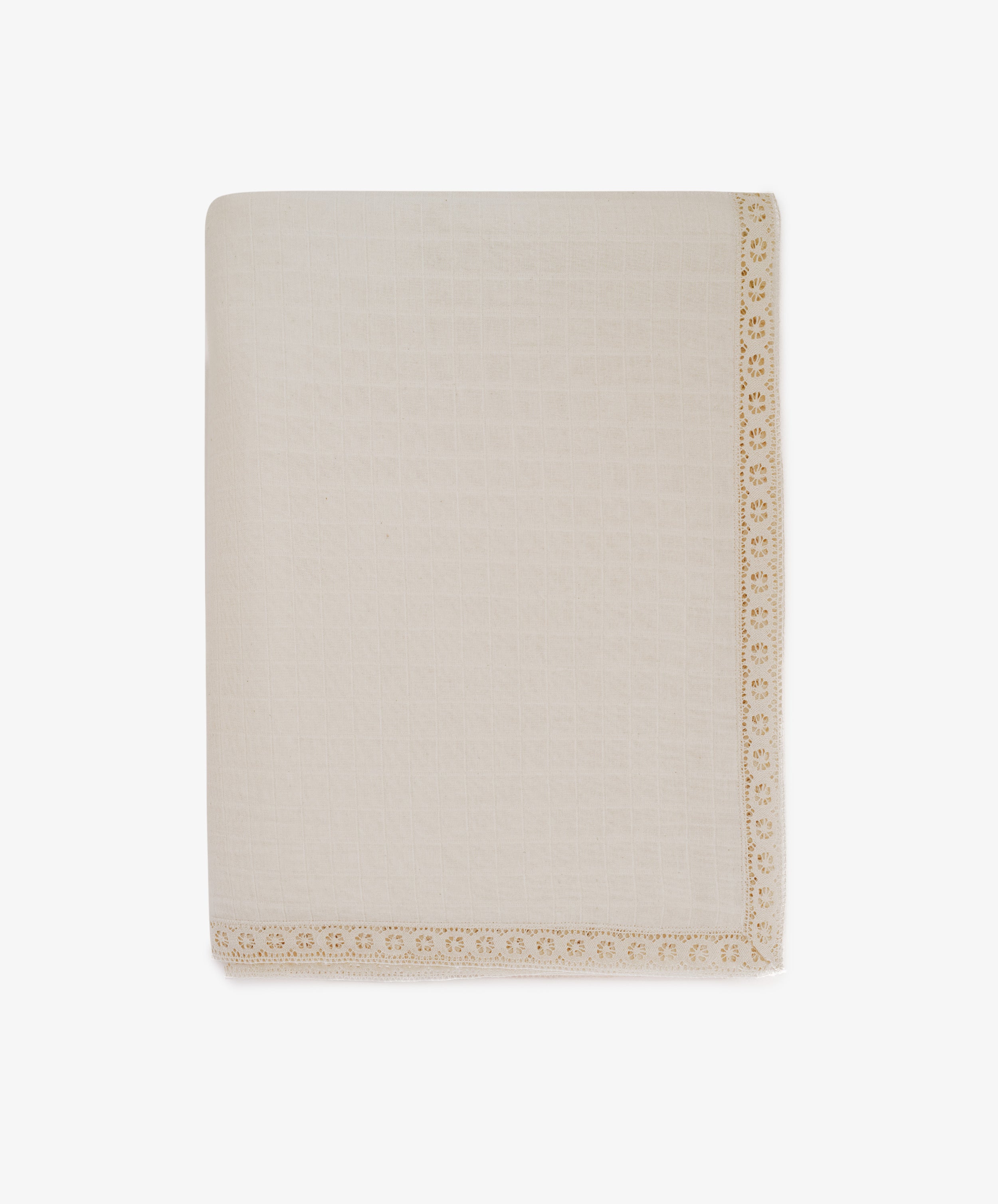 The Double Gauze Flower Tablecloth is cream-colored with a textured surface and features decorative yellow lace trim along one edge, displayed folded against a white background.