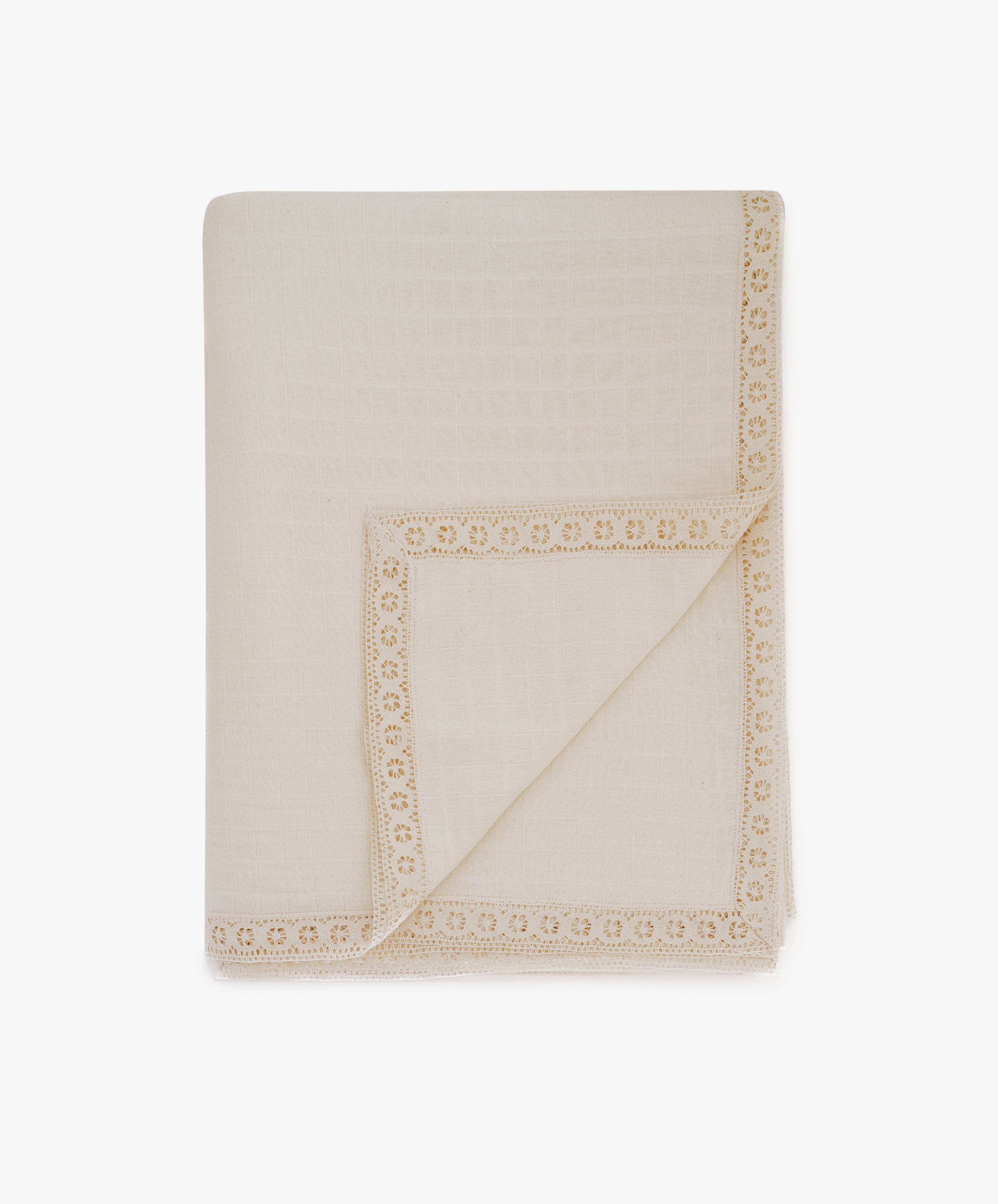The Double Gauze Flower Tablecloth is a cream-colored, folded cloth with decorative lace trim along the edges, resembling a soft and airy blanket, displayed against a white background.