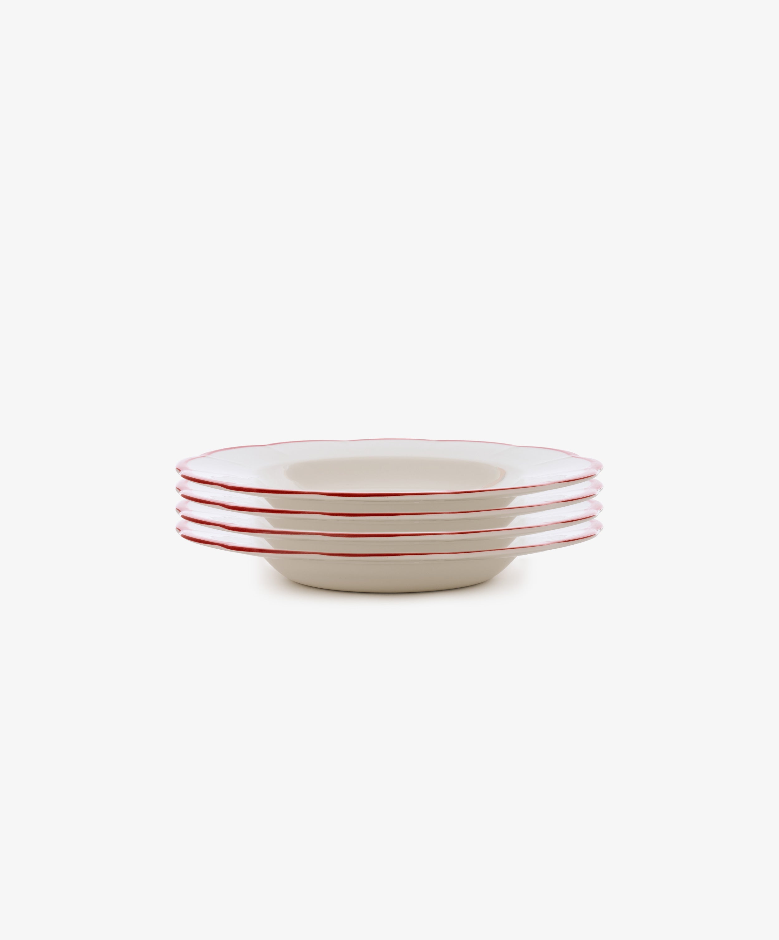 The Petalo Pasta Bowl, Set of 4 features white ceramic plates with red rims, inspired by classic Italian ceramics, displayed on a plain white background.