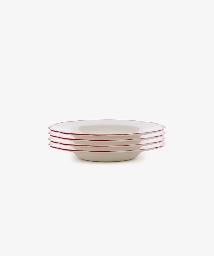 The Petalo Pasta Bowl, Set of 4 features white ceramic plates with red rims, inspired by classic Italian ceramics, displayed on a plain white background.