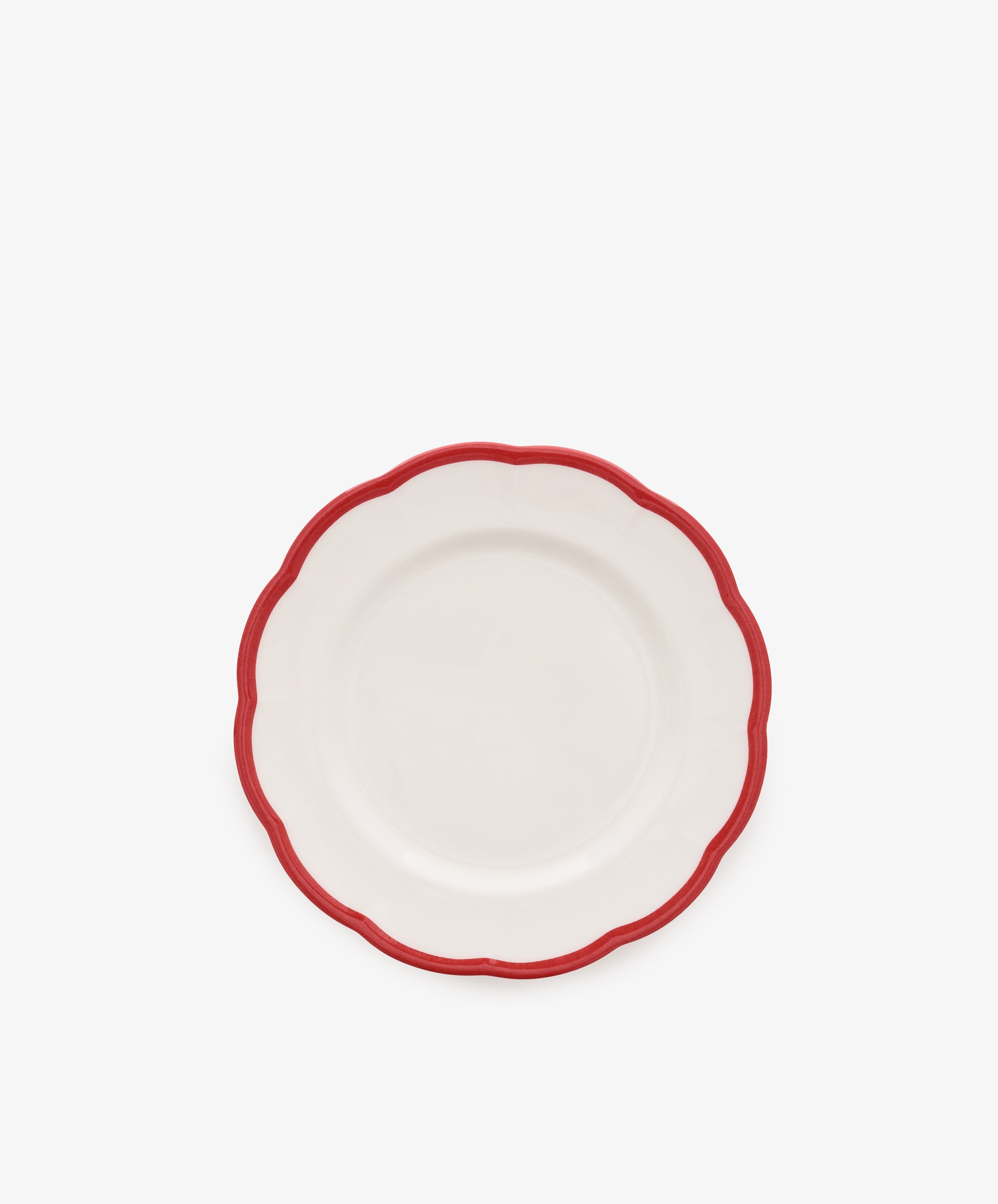 The Petalo Small Plate, Set of 4 by Bitossi Home features white Italian ceramic with scalloped edges and a red border, displayed on a plain white background.