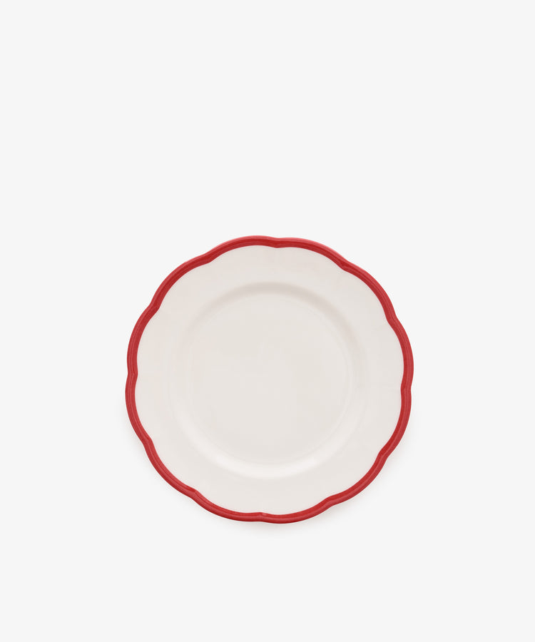 The Petalo Small Plate, Set of 4 by Bitossi Home features white Italian ceramic with scalloped edges and a red border, displayed on a plain white background.