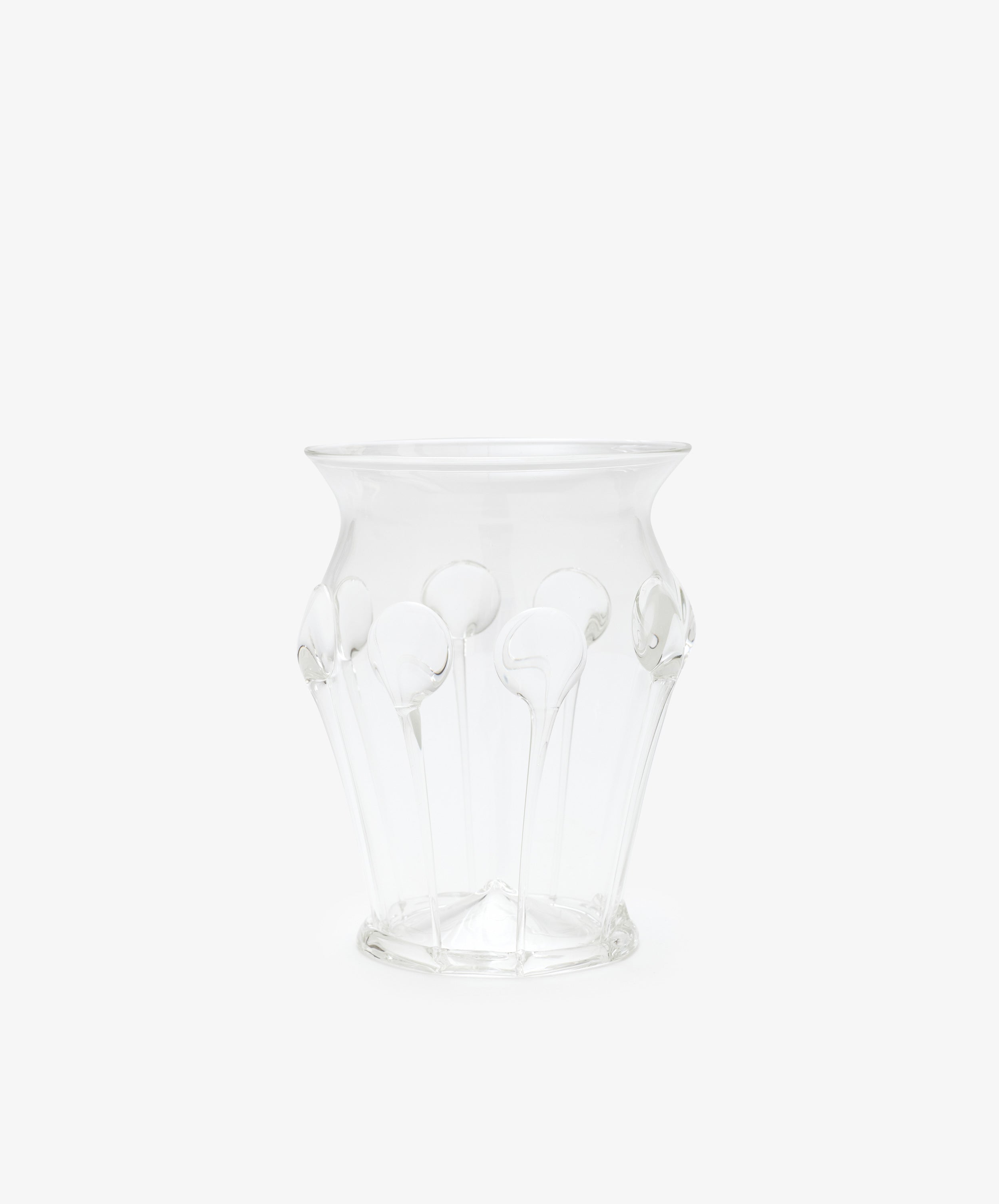 The Carlotta Vase features clear glass with a flared rim and decorative raised patterns, highlighting Bohemian artistry against a plain white background.