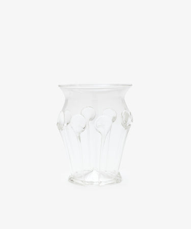 The Carlotta Vase features clear glass with a flared rim and decorative raised patterns, highlighting Bohemian artistry against a plain white background.