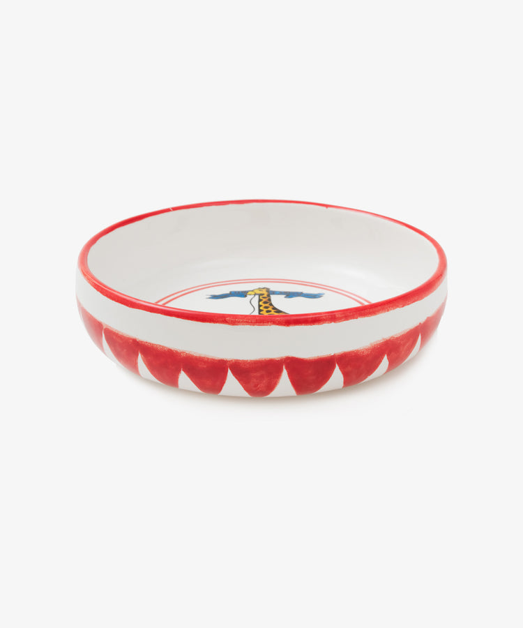Palio Pasta Bowl in white glazed ceramic with red accents and giraffe motif, side view.