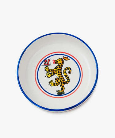Palio Pasta Bowl in white glazed ceramic with blue and red accents and panther motif. 