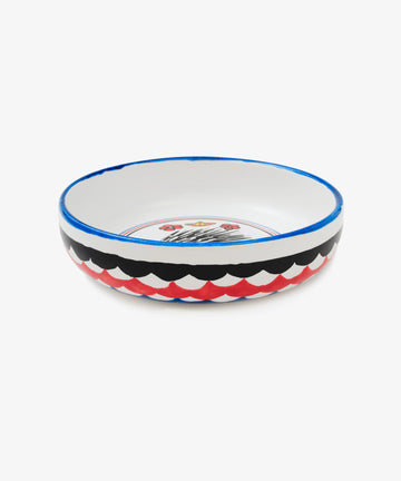 Palio Pasta Bowl in white glazed ceramic with blue and red accents and porcupine motif, side view.