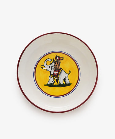 Palio Pasta Bowl in white glazed ceramic with burgundy and yellow accents and tower and elephant motif.